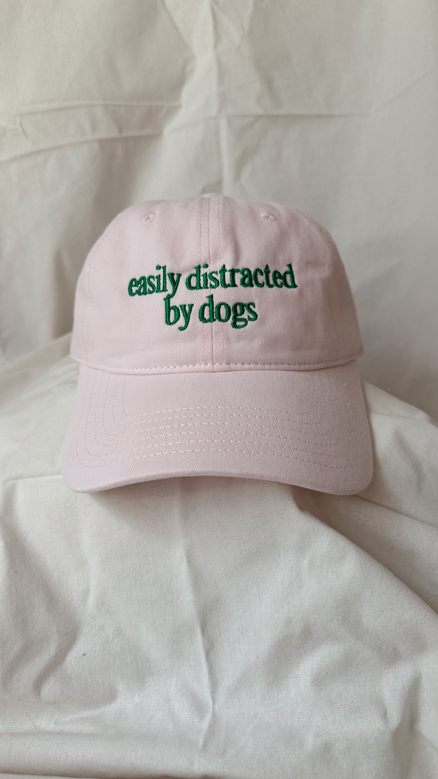 Easily Distracted by Dogs – Light Pink Cap with Green Embroidery