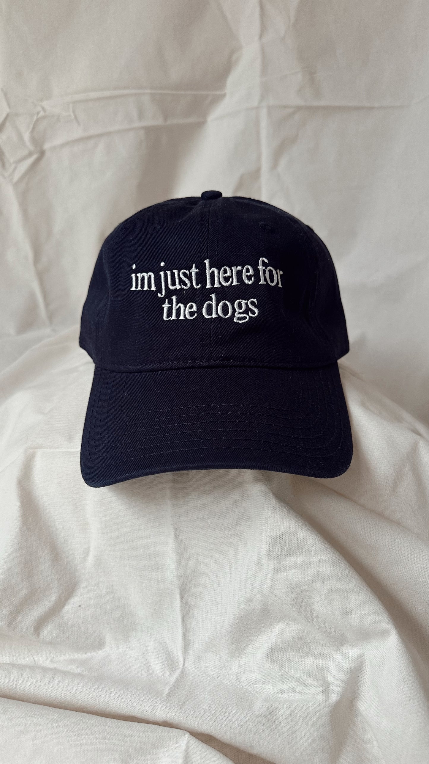 I’m Just Here For The Dogs – Deep Navy Cap with White Embroidery